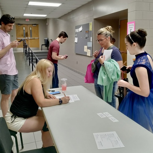 Parents and helpers volunteering backstage during recital